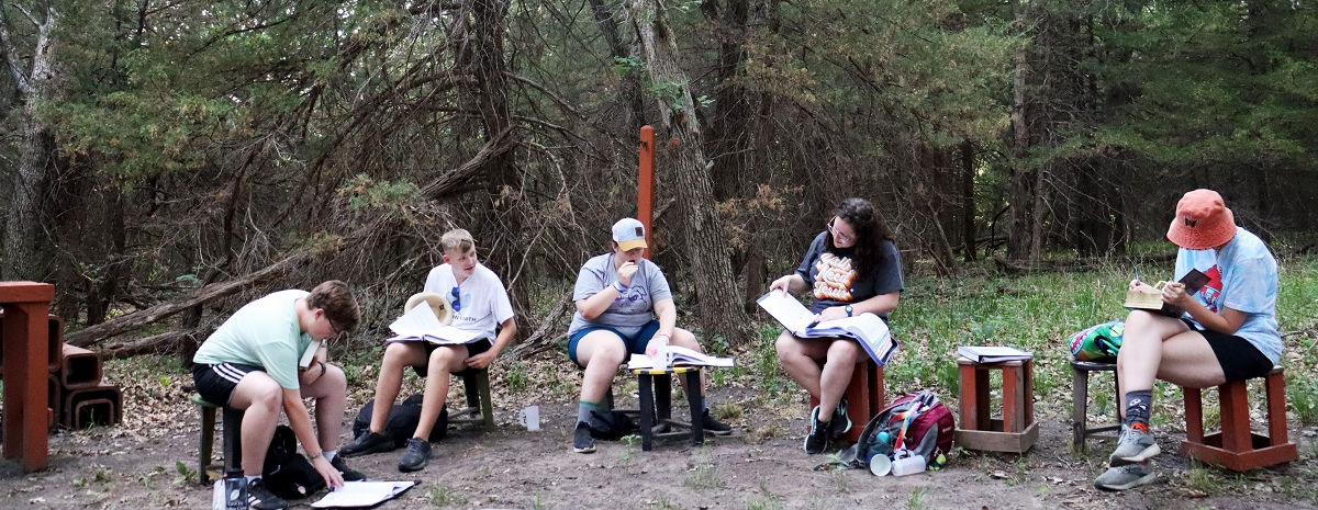 Group of campers in pray outdoors